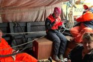 The crew set up the tent at the raised aft to relax in dry weather during the summer rain